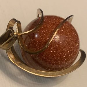 Out of this world Gold stone pendant